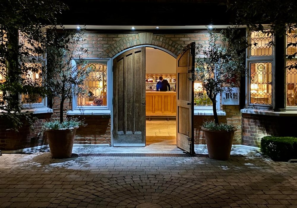 The arrival court at Greenwynd after dark