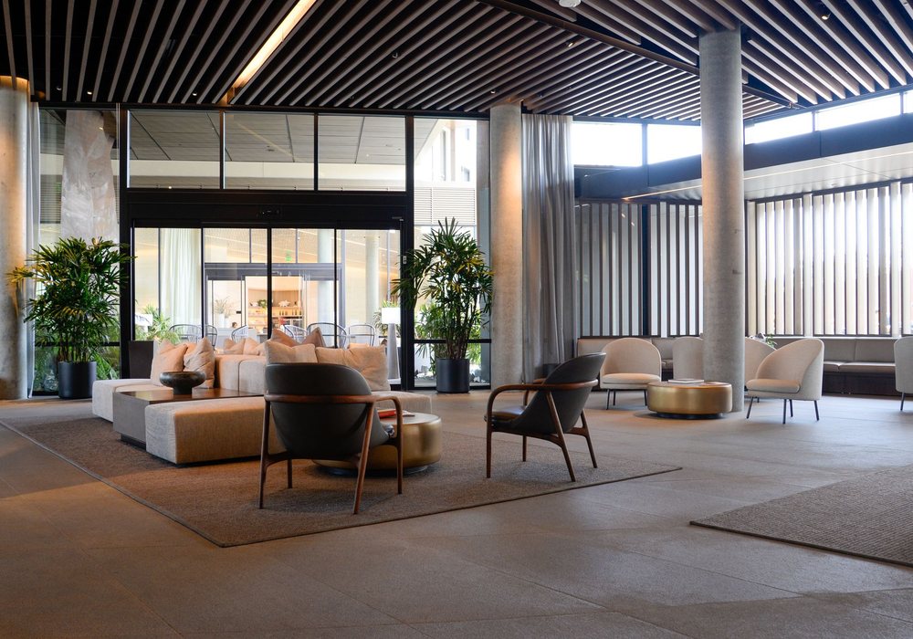 The Greenwynd lobby lounge with armchairs and warm lamplight